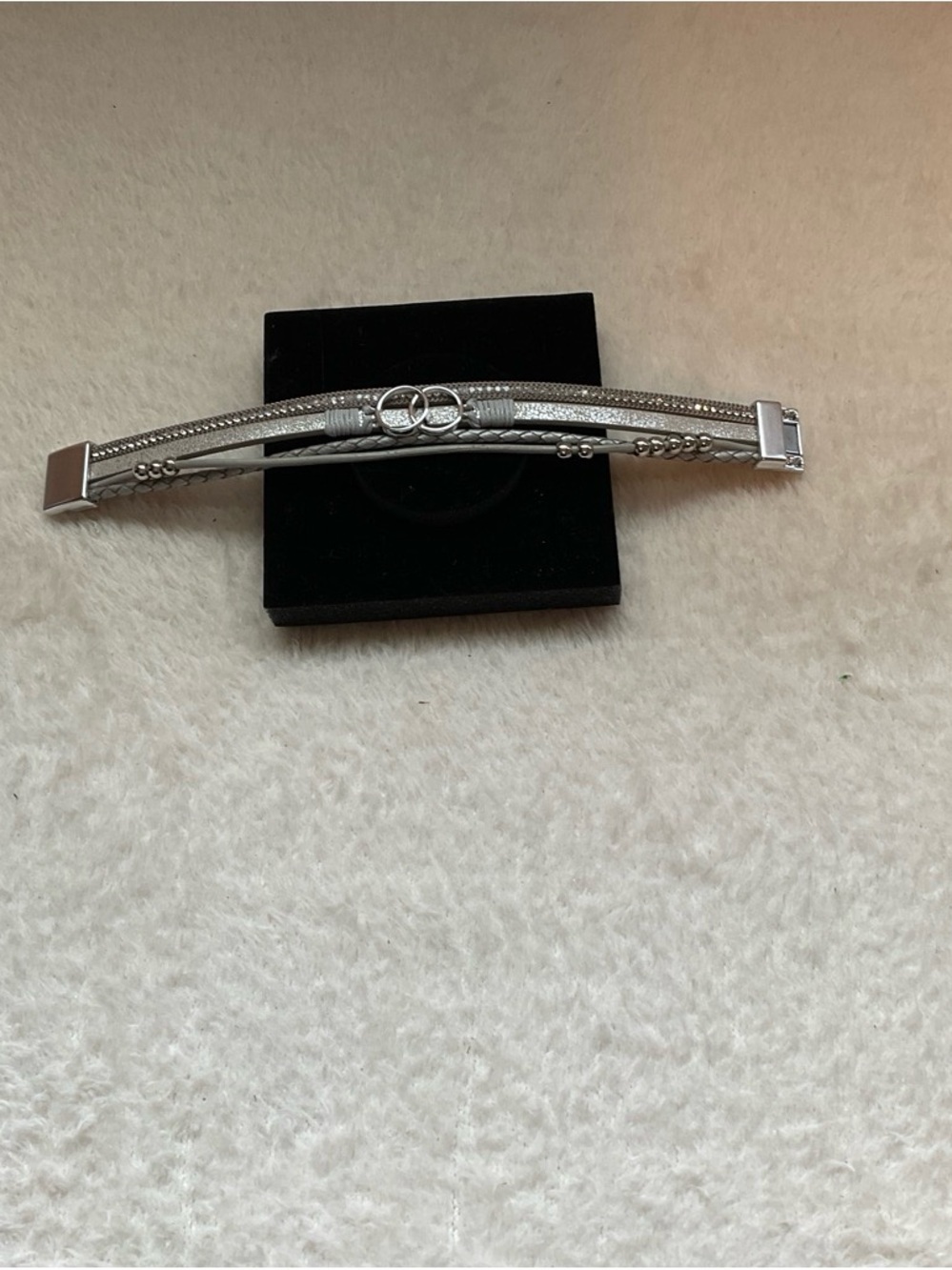 Silver Multi-Chain Bracelet with Interlocking Ring Accent